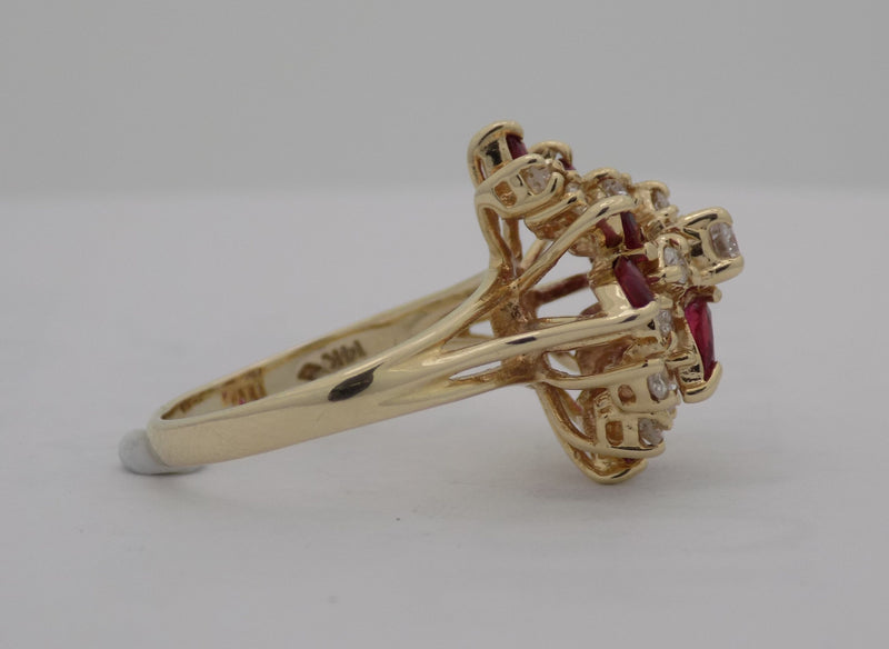 Yellow gold natural ruby diamond cluster ring.