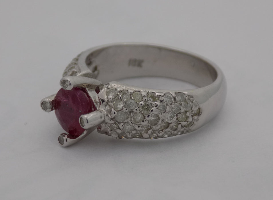 White gold pave' diamond band with natural round ruby.