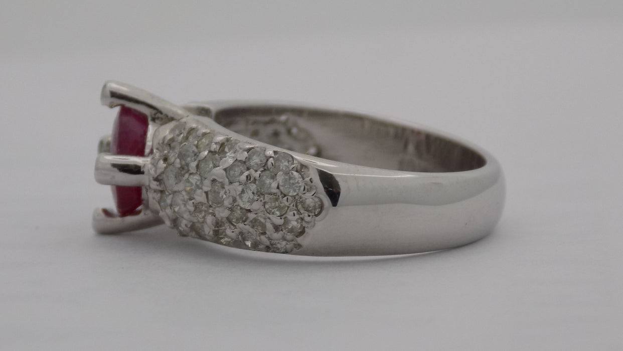 White gold pave' diamond band with natural round ruby.