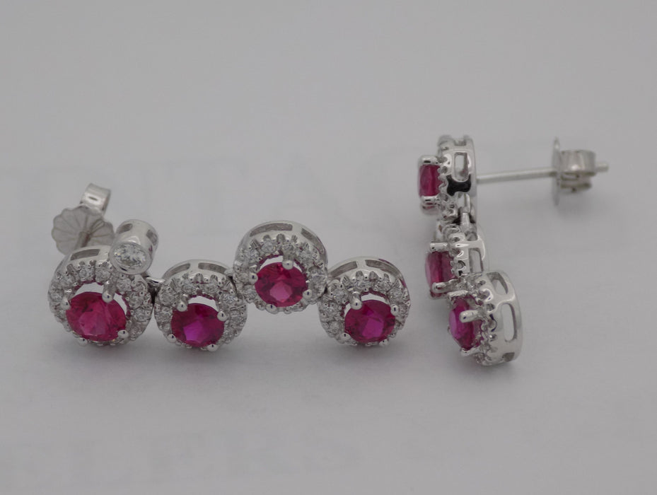 White gold natural ruby with halo diamond drop earrings.