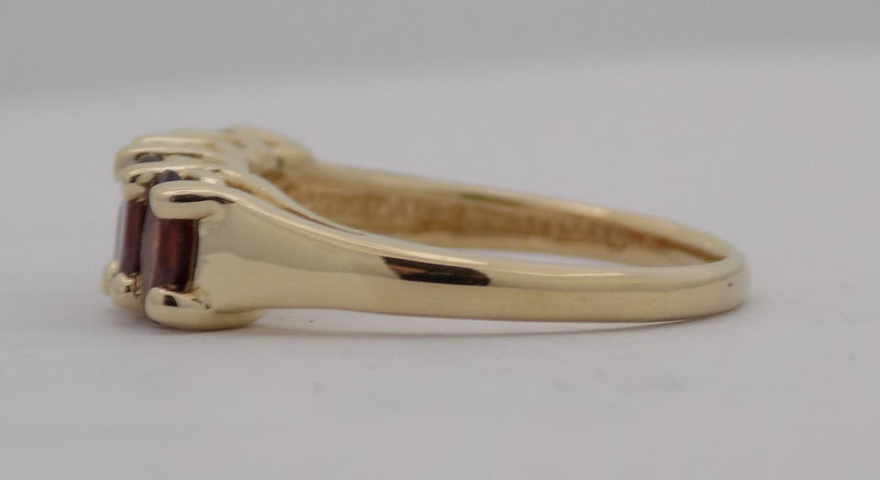 Yellow gold oval garnet band.