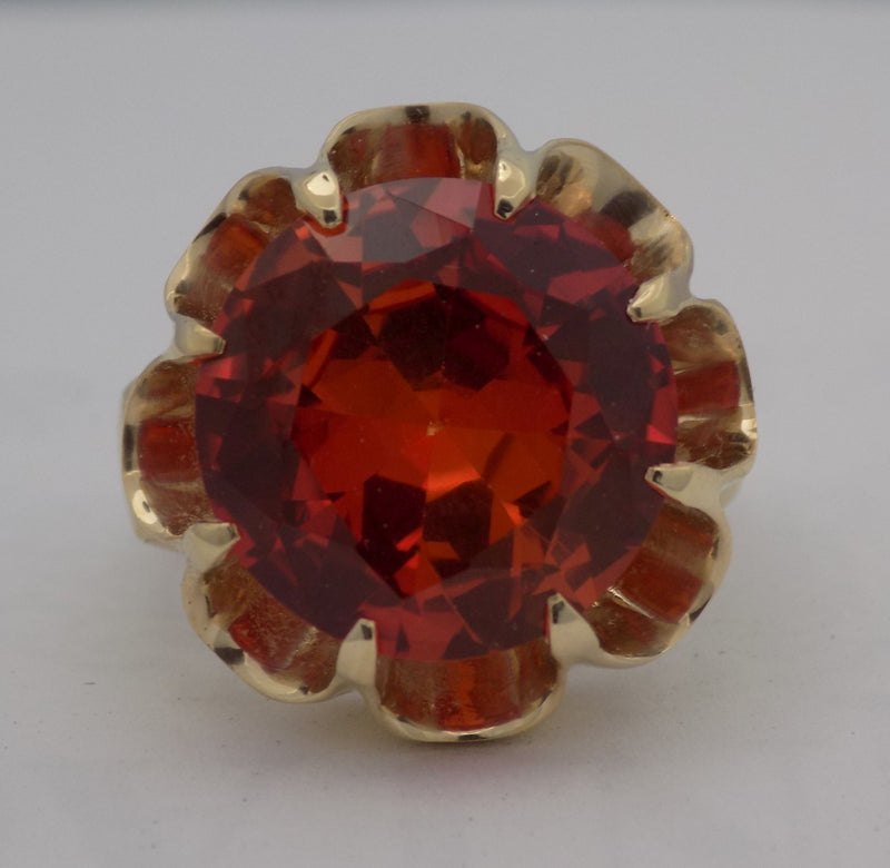 Yellow gold padparadscha sapphire ring.