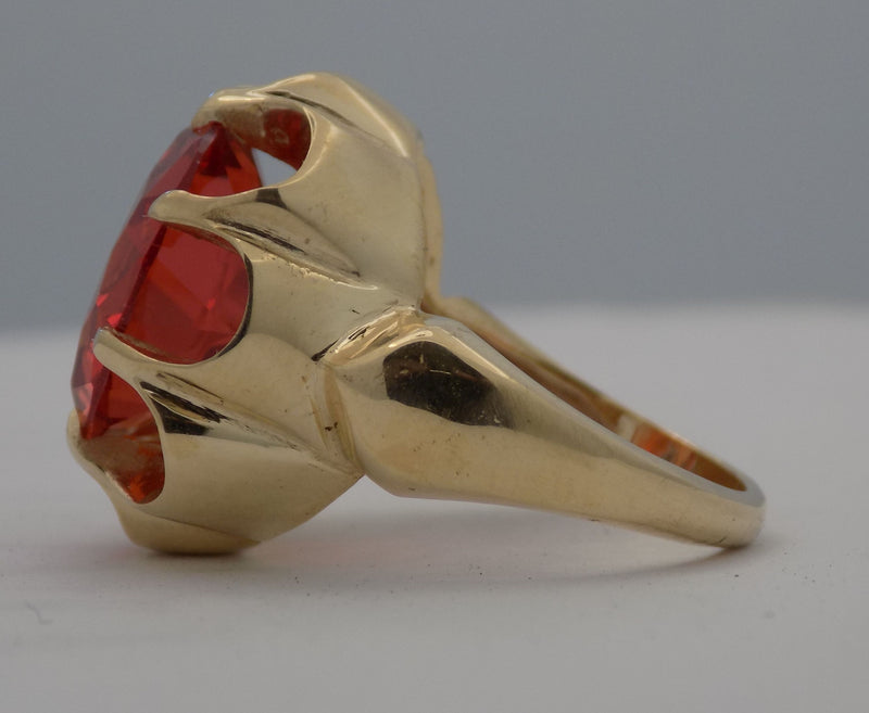 Yellow gold padparadscha sapphire ring.