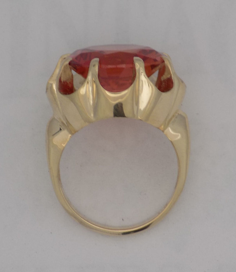 Yellow gold padparadscha sapphire ring.