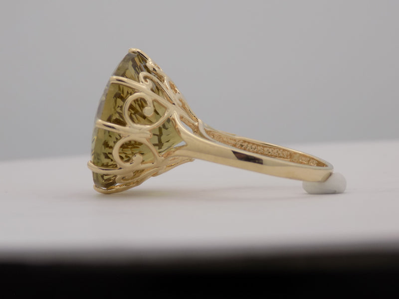 Yellow gold round lemon citrine fantasy cut ring.