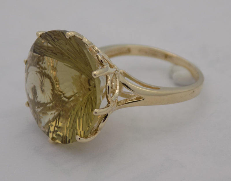 Yellow gold round lemon citrine fantasy cut ring.