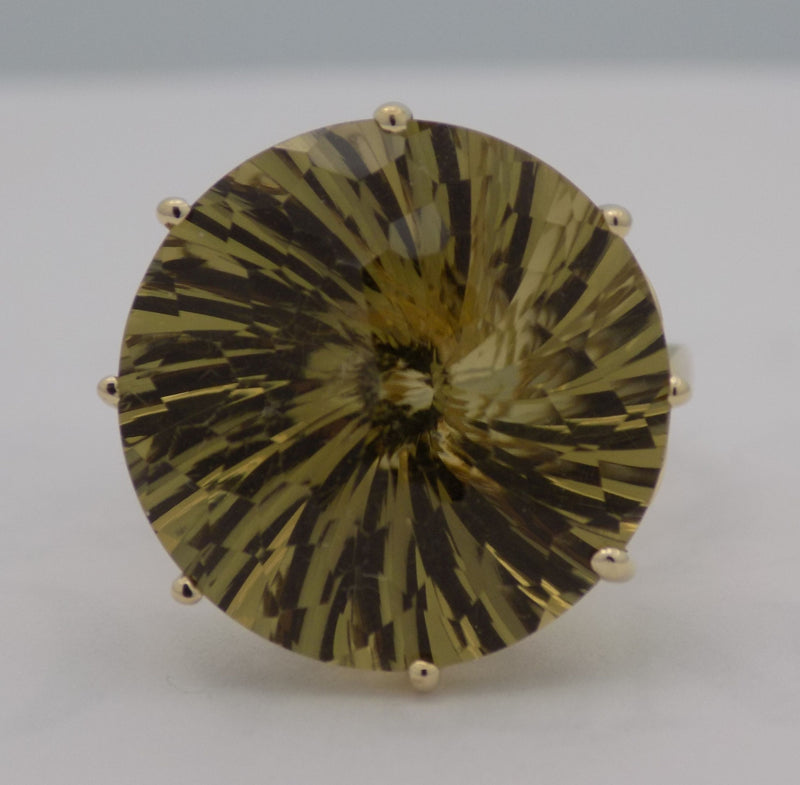 Yellow gold round lemon citrine fantasy cut ring.