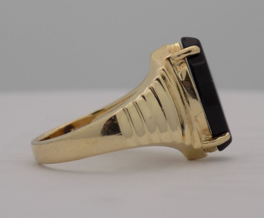 Yellow gold estate marquise shaped onyx ring.