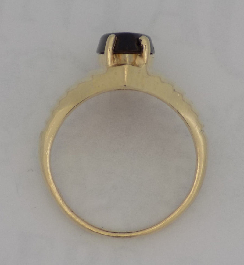 Yellow gold estate marquise shaped onyx ring.