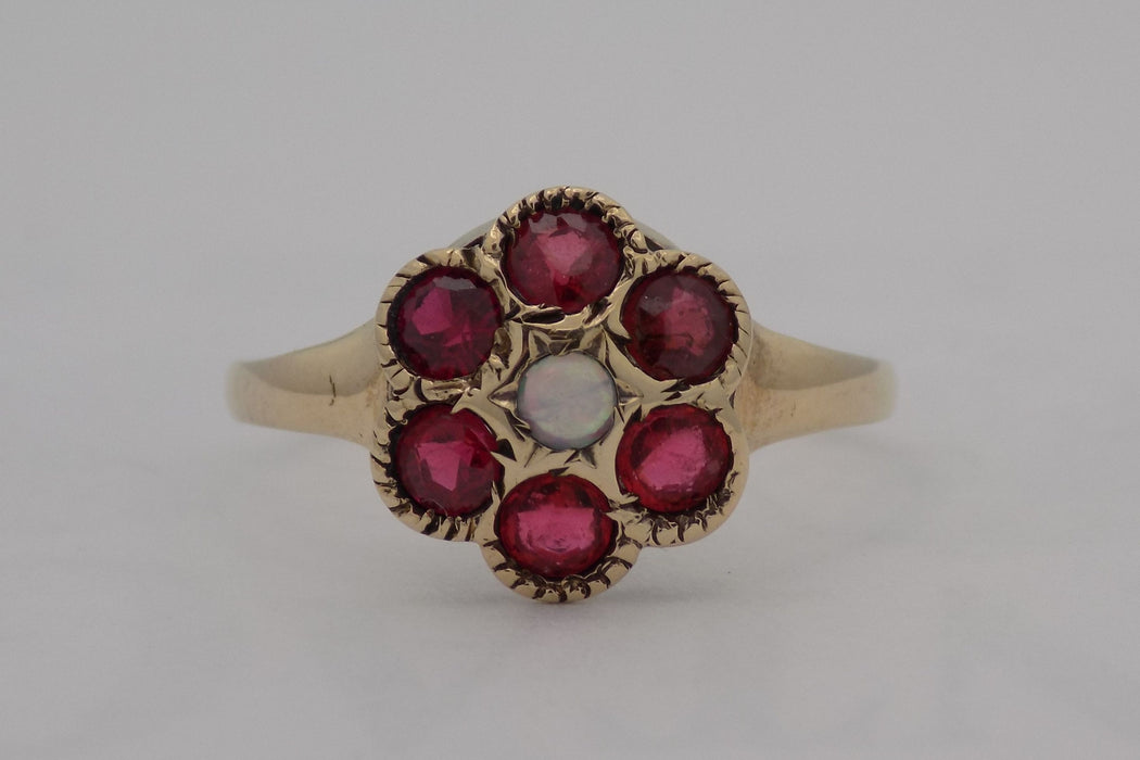 Vintage yellow gold garnet and opal ring.