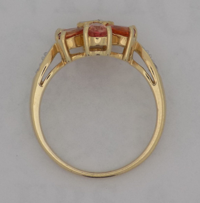 Yellow gold pear shaped topaz and diamond ring.