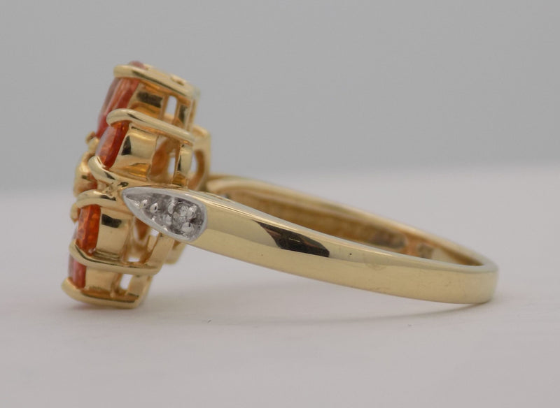 Yellow gold pear shaped topaz and diamond ring.