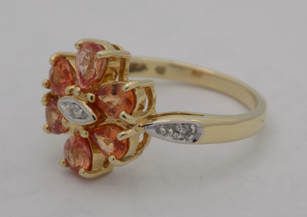 Yellow gold pear shaped topaz and diamond ring.