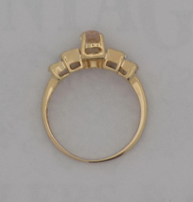 Yellow gold oval morganite with diamond ring.