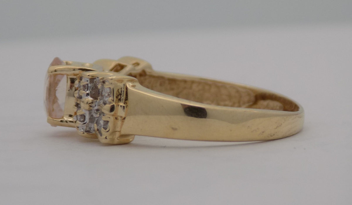 Yellow gold oval morganite with diamond ring.