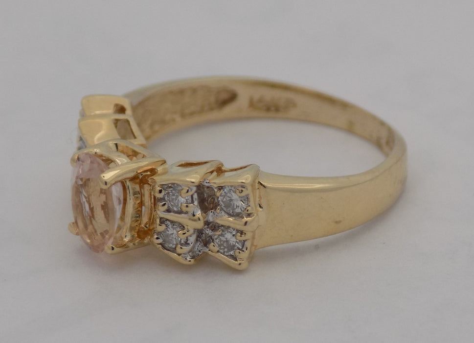 Yellow gold oval morganite with diamond ring.