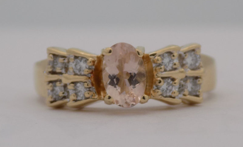 Yellow gold oval morganite with diamond ring.