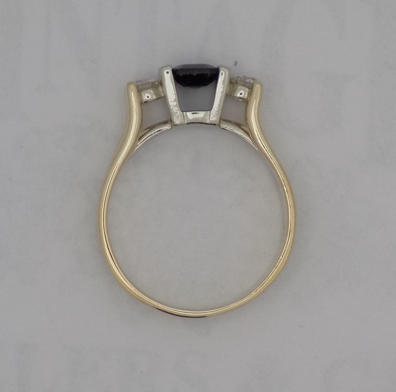 Sapphire and diamond three stone ring.