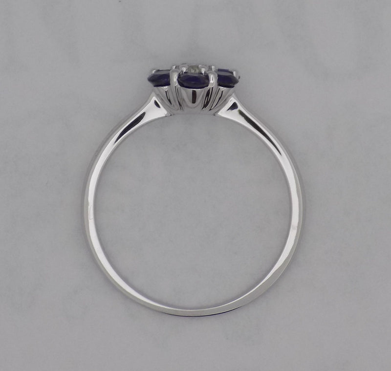 White gold blue sapphire and diamond ring.