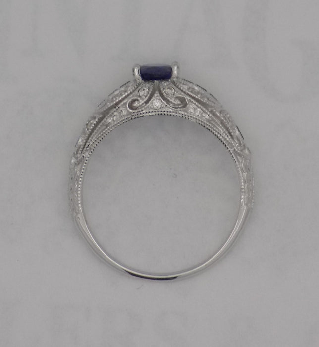 White gold filigree diamond and sapphire ring.