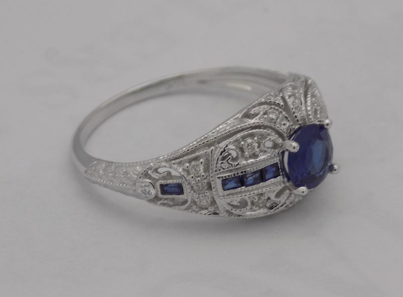 White gold filigree diamond and sapphire ring.