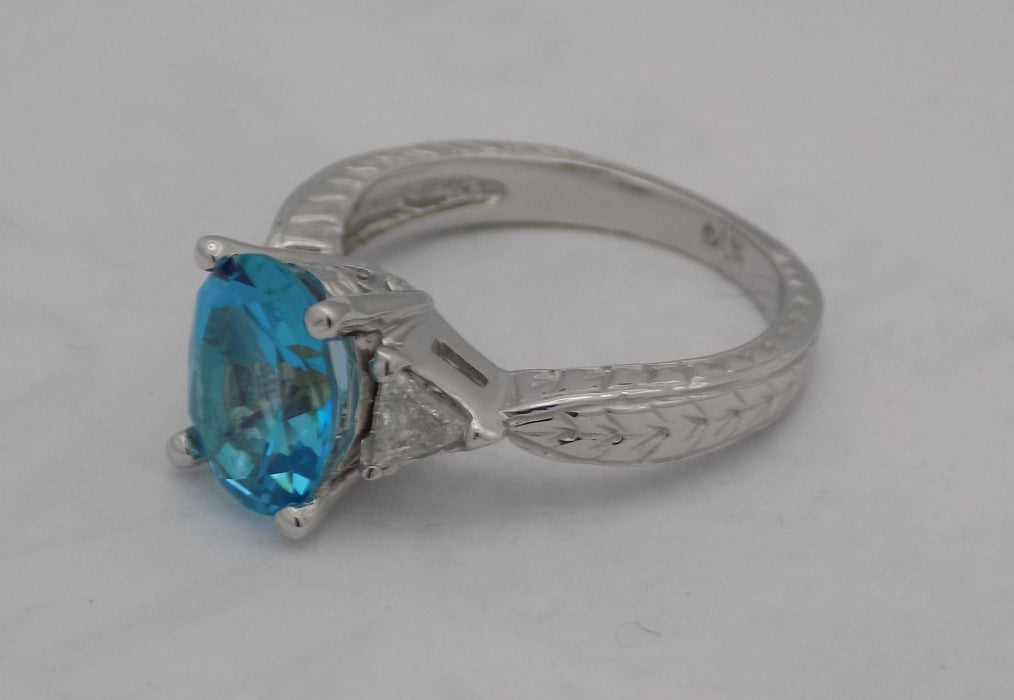 White gold blue topaz and diamond ring.