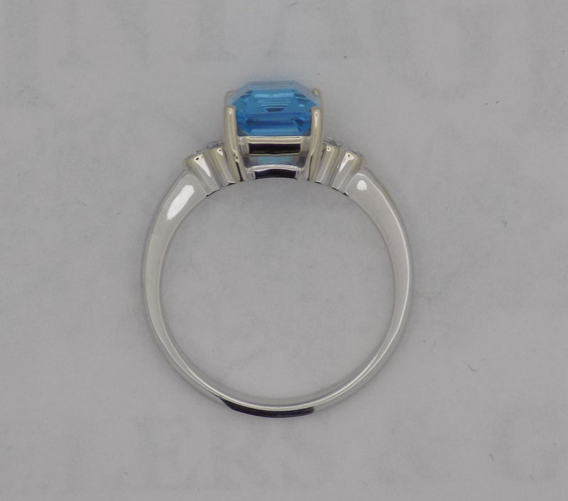 White gold blue topaz and diamond ring
