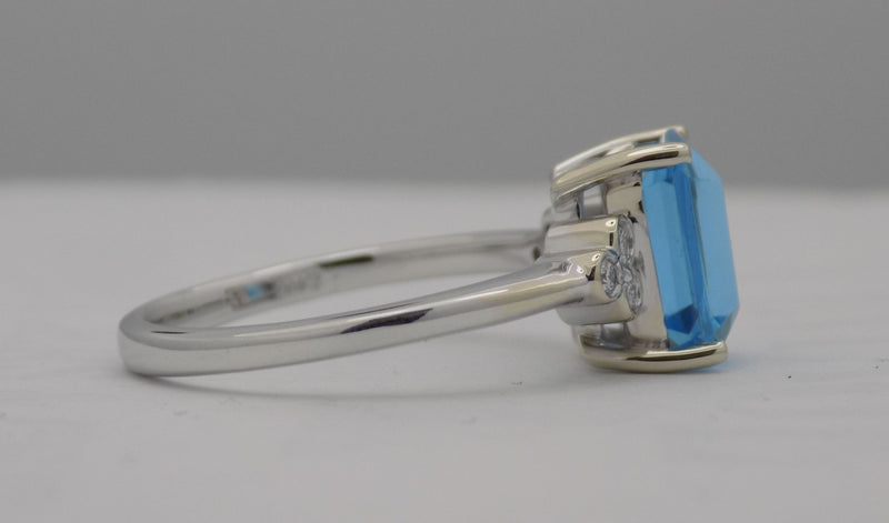 White gold blue topaz and diamond ring