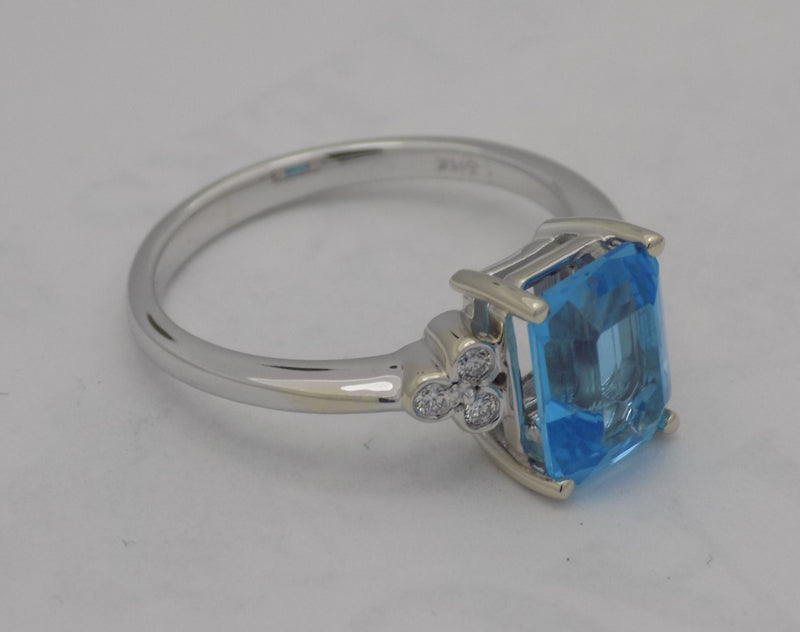 White gold blue topaz and diamond ring