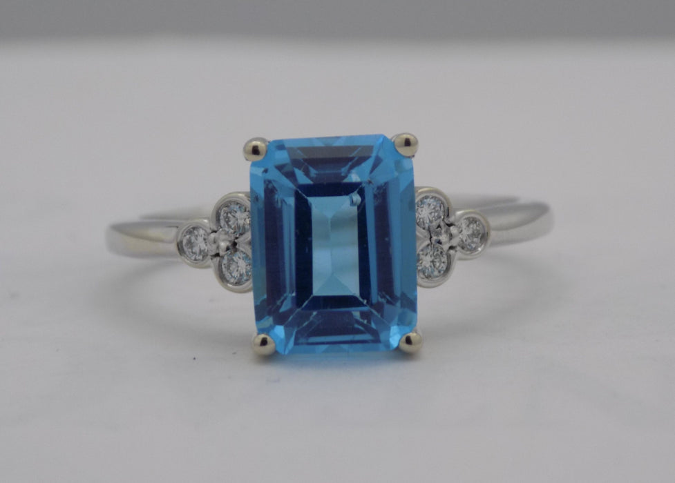 White gold blue topaz and diamond ring