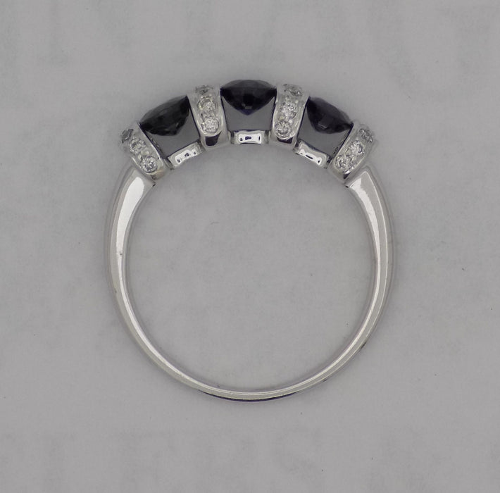 White gold diamond and sapphire bar set ring.