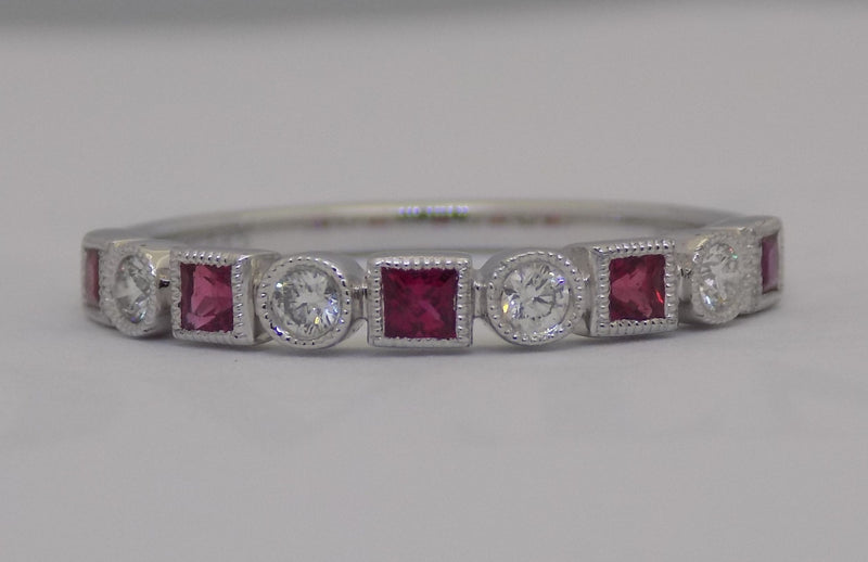White gold square cut ruby and diamond band.