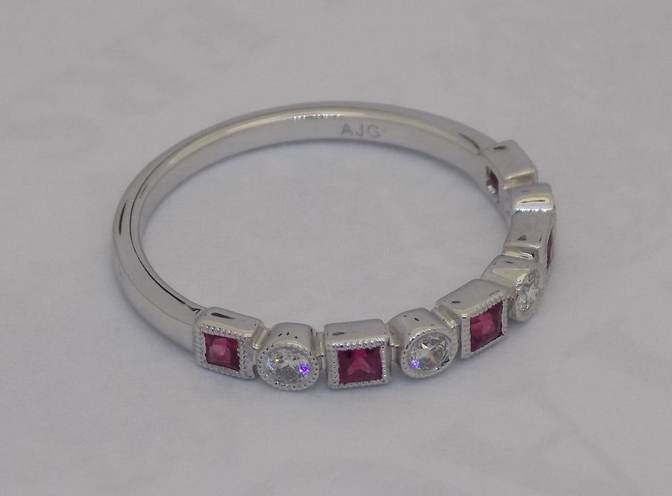 White gold square cut ruby and diamond band.