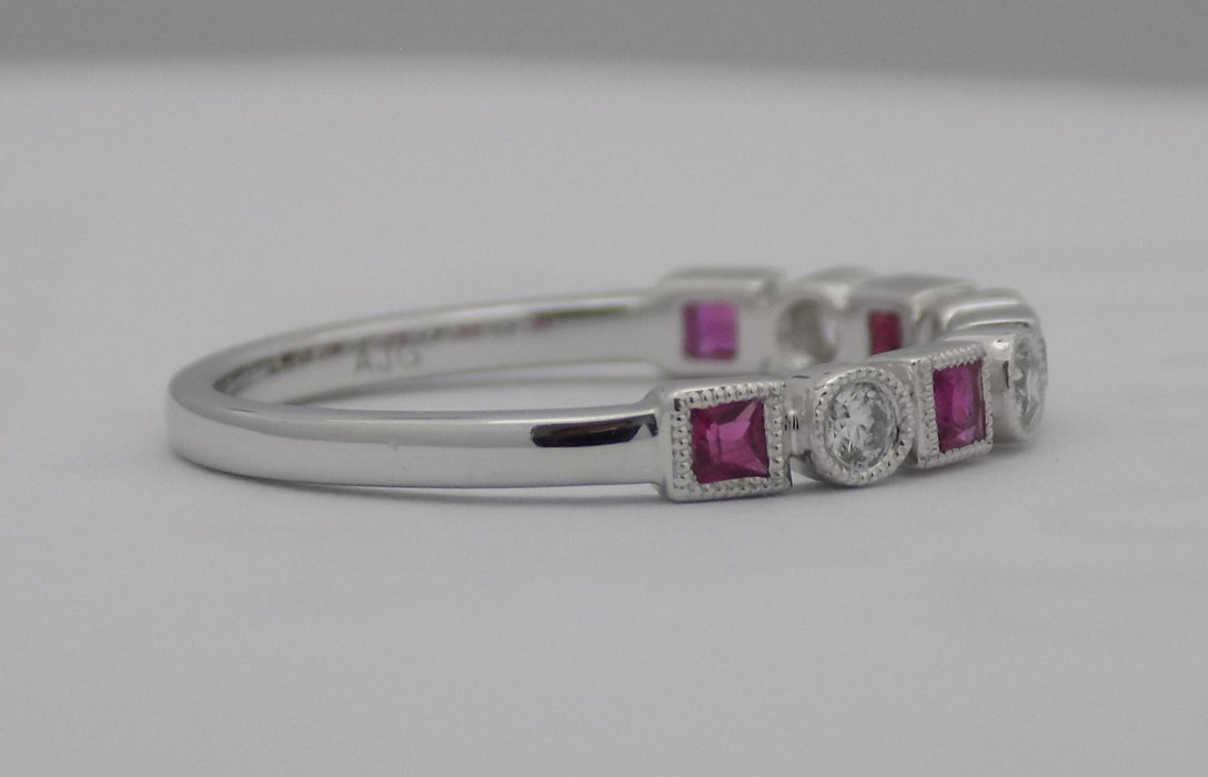 White gold square cut ruby and diamond band.