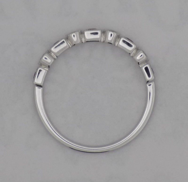 White gold square cut ruby and diamond band.