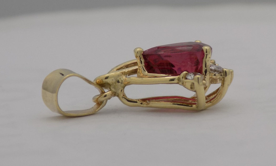 Yellow gold pear shaped rubellite pendant.