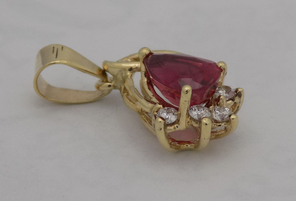 Yellow gold pear shaped rubellite pendant.