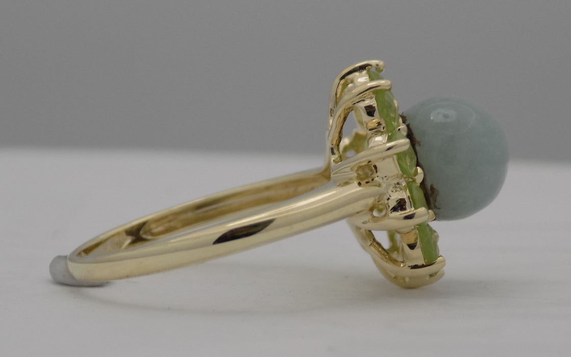 Yellow gold jadeite bead with peridot ring.
