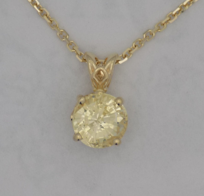 Yellow gold natural golden sapphire pendant.