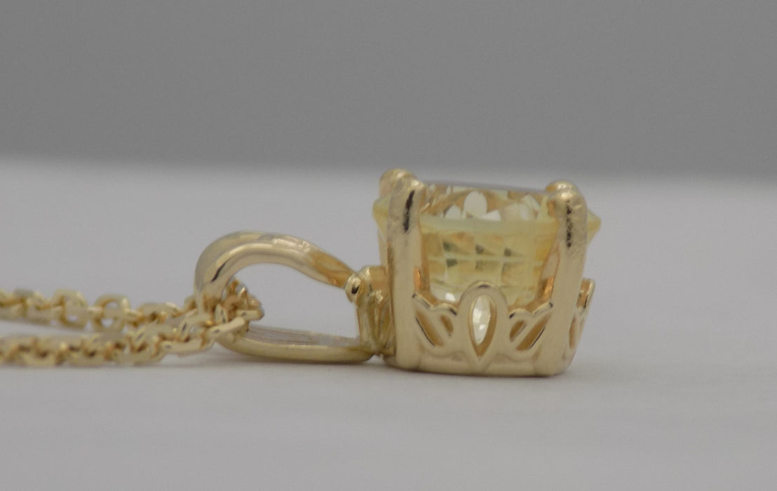 Yellow gold natural golden sapphire pendant.