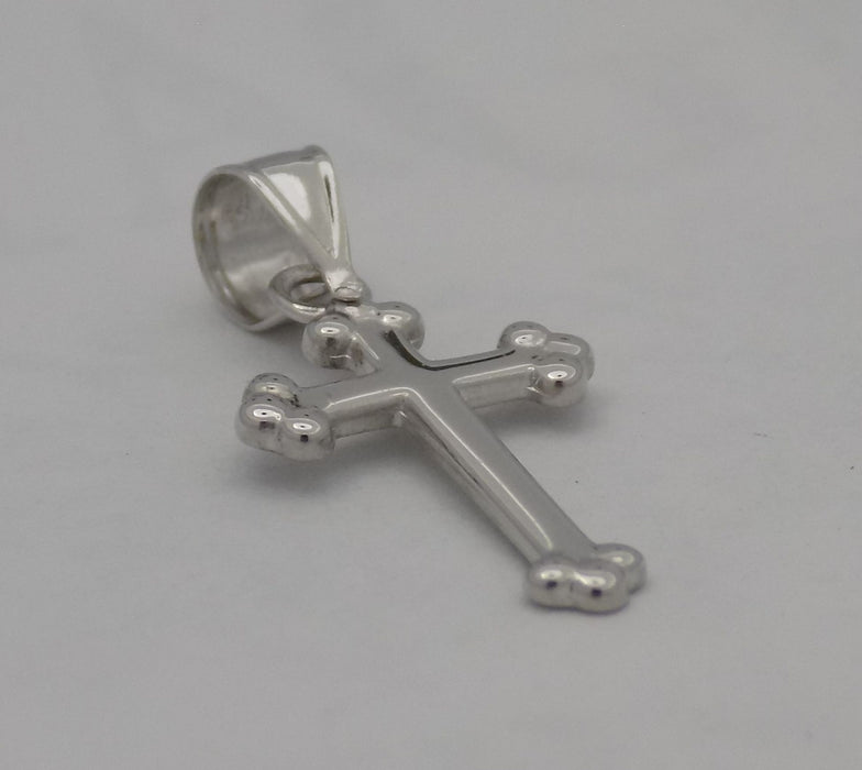 14 karat white gold small budded cross, angled view