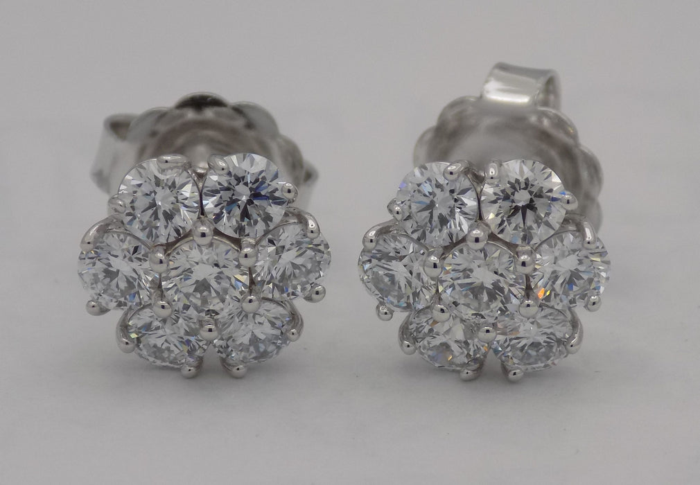 White gold diamond cluster earrings.