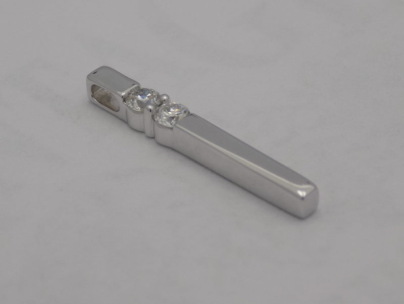 14 k white gold vertical diamond bar pendant.