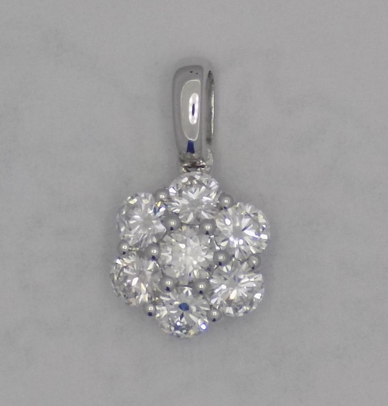 White gold 7 diamond cluster pendant.