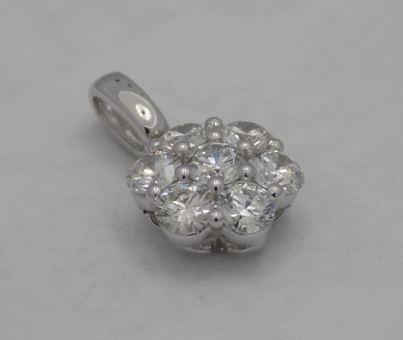 White gold 7 diamond cluster pendant.