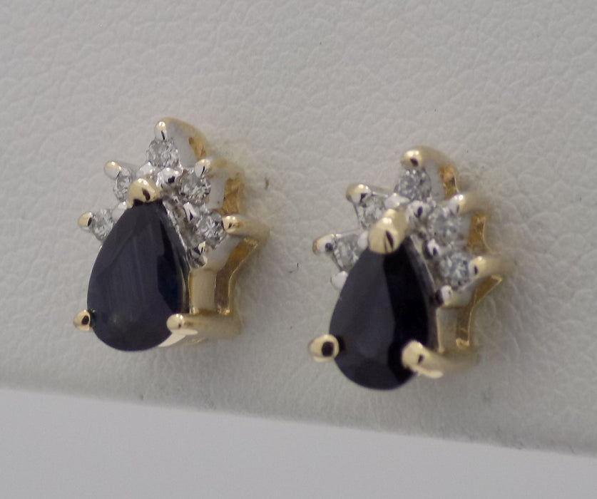 14 karat yellow gold pear shaped sapphire earrings with crown trim of diamonds.