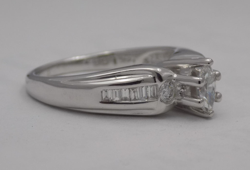White Gold marquise center diamond with baguette side diamonds.