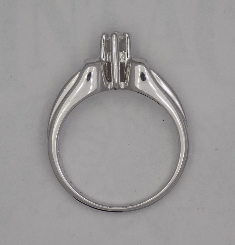 White Gold marquise center diamond with baguette side diamonds.