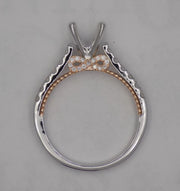 14 karat  two-tone, white and rose gold diamond semi-mount  engagement ring with infinity design, side view through finger,