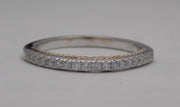 14 karat two-tone, white and rose gold diamond wedding band with infinity design, top view.